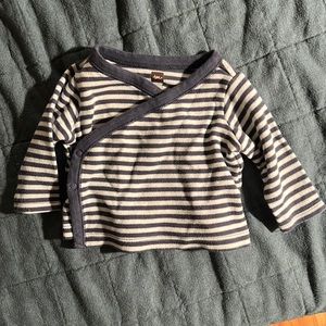 Navy and white stripe top with kimono style cross-body snap opening. EUC